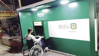 «البنك الأهلي» يطلق ماكينات صراف آلى لـ«ذوى الأحتياجات الخاصة»