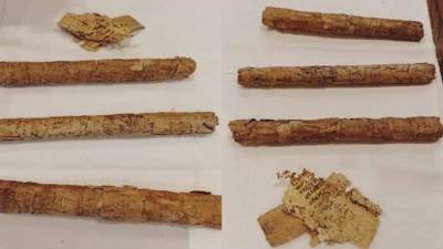 ضبط 13 مخطوط أثري و3 لفائف من ورق البردي بمطار القاهرة الدولي