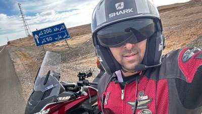 الرحالة كريم حسني في رحلته لكأس العالم بقطر بالدراجة النارية