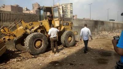 حملات رفع كفاءة وتمهيد الطرق المجاورة للطريق الدائري ورفع المخلفات والردش بالعمرانية