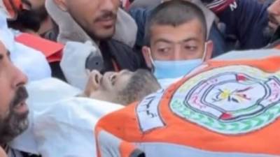 الدفاع المدني الفلسطيني يودع شهداءه نتيجة القصف الإحتلال