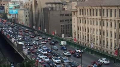 تكدس مرورى بمحاور القاهرة والجيزة بسبب تراكمات مياه الأمطار