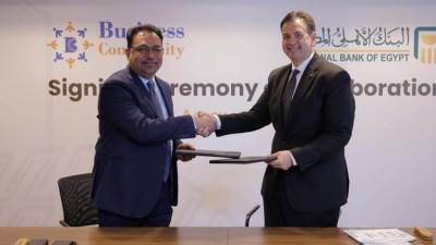 بروتوكول تعاون بين البنك الأهلي المصري وشركة "بيرنس كوميونتي"